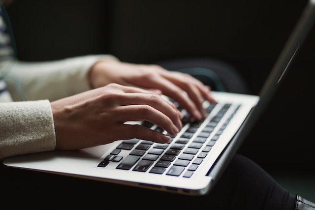 person typing on computer